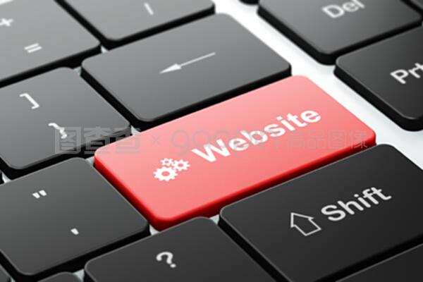 电脑键盘背景的网页开发概念齿轮及网站